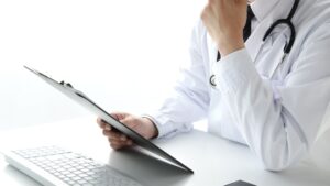 Discreet image of a man looking thoughtful, representing erectile dysfunction causes and testing.